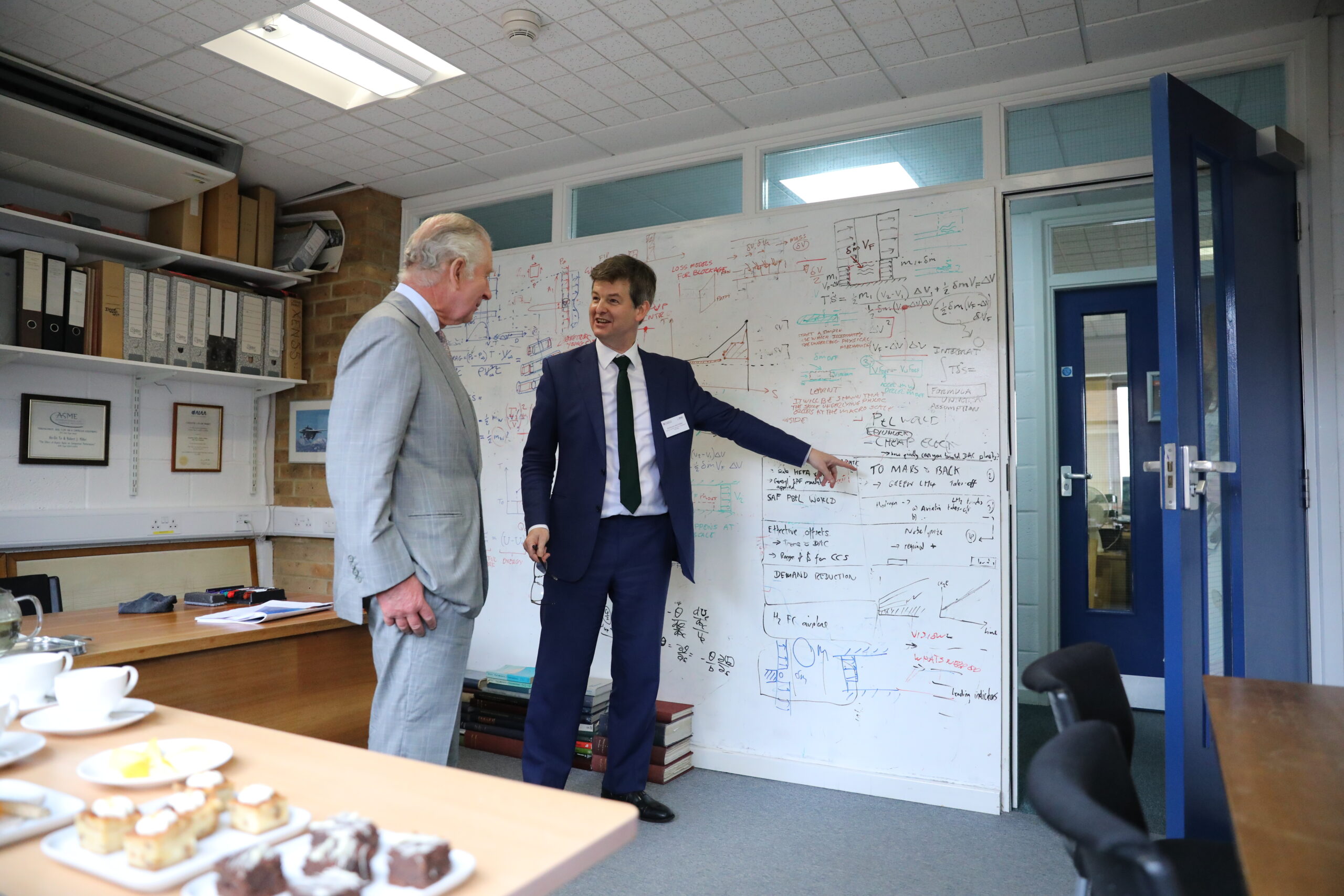 His Majesty the King discussing sustainable aviation technology with Prof Rob Miller